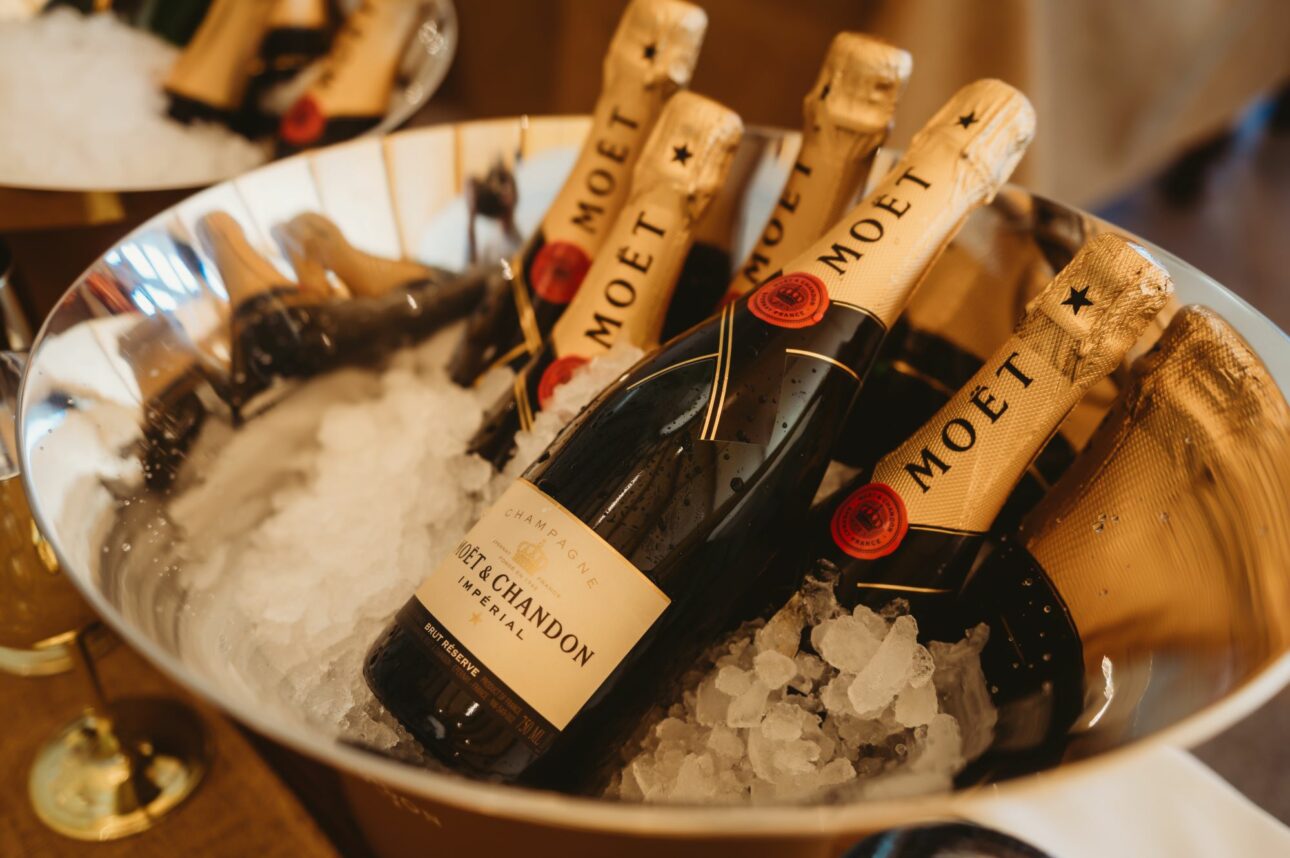 A silver bucket filled with ice and multiple bottles of Moët & Chandon champagne.