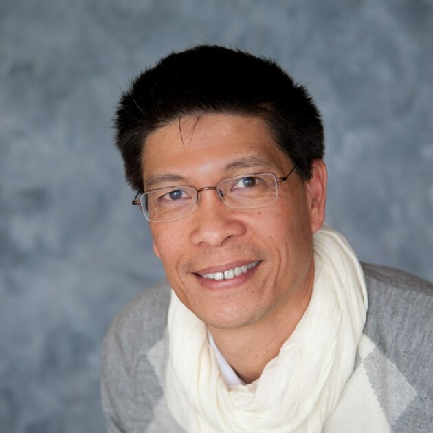 Kalson Pang smiling.