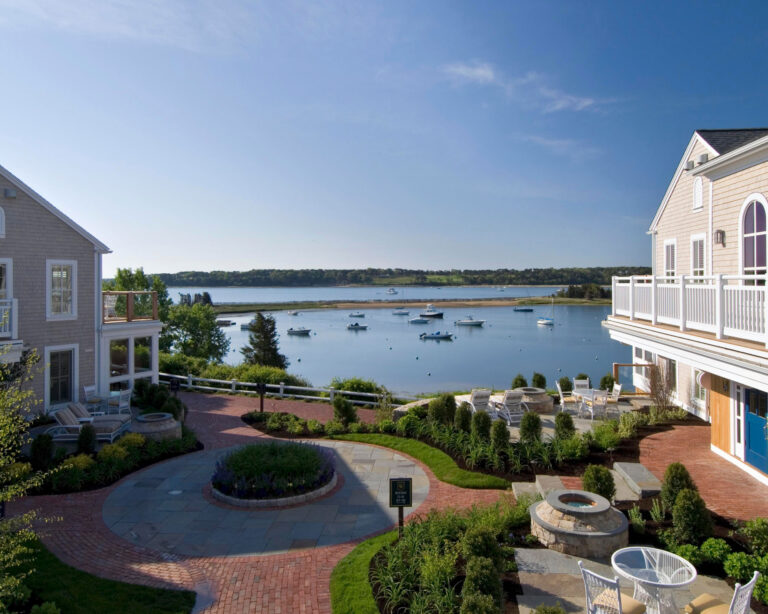 Grass between homes and ocean view.