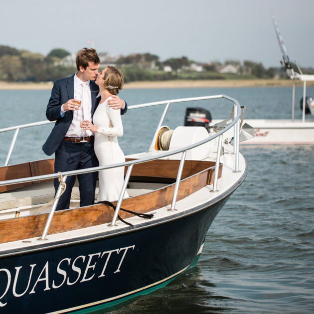A couple sharing a kiss on a boat.