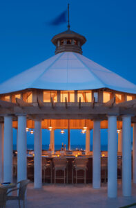 Gazebo under blue sky and lights.