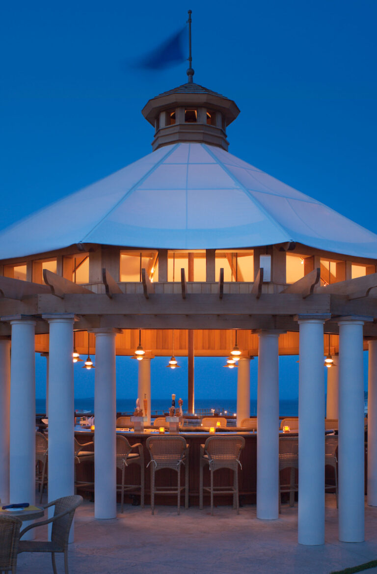Gazebo under blue sky and lights.